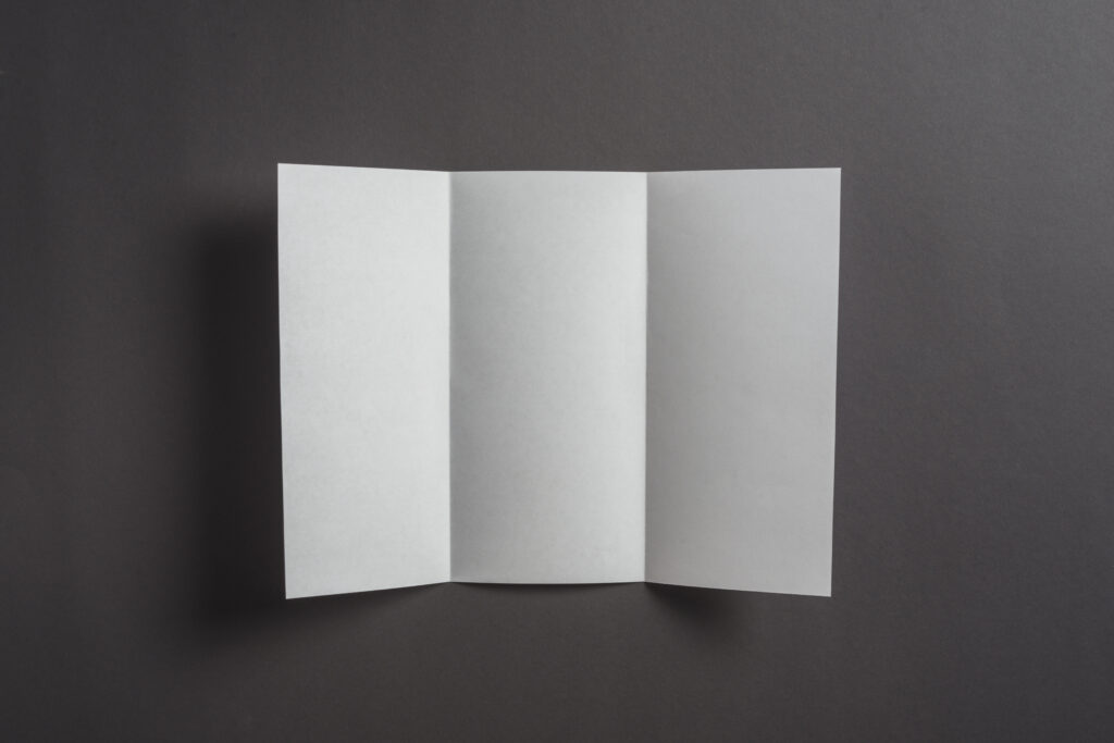 blank-sheet-paper-black-backdrop