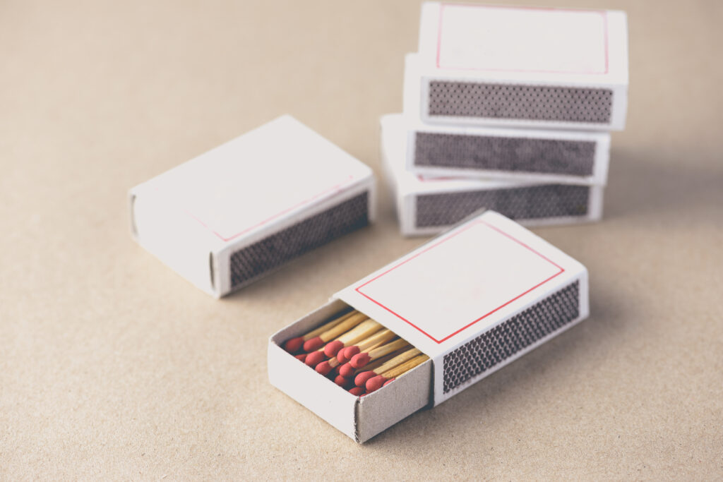 Box of matches on brown paper background